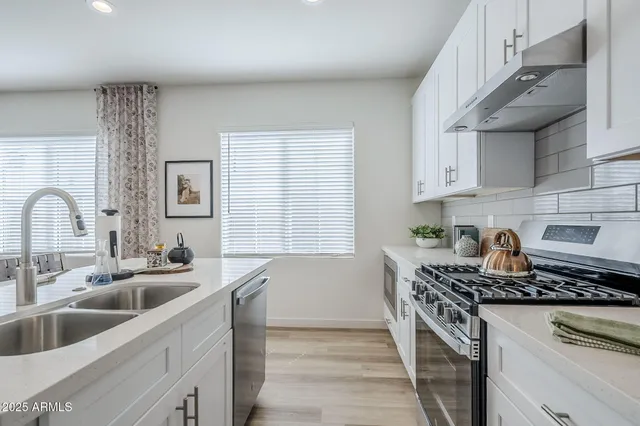 a view of a livingroom with furniture and wooden floor
