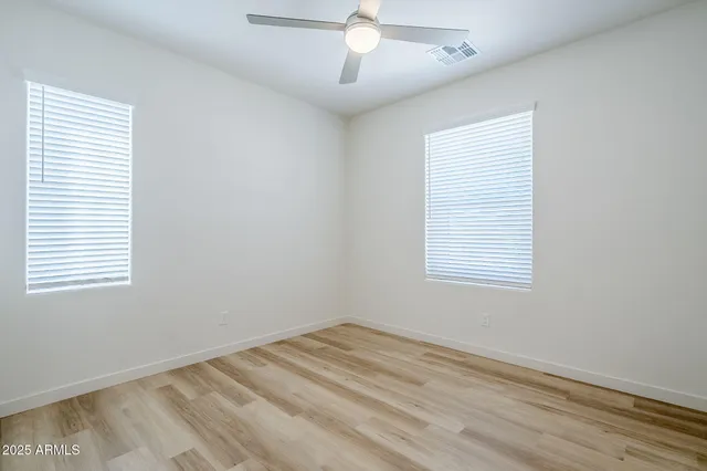 a front view of a house with a yard and outdoor seating