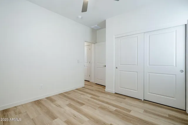 a front view of a house with a garden and yard