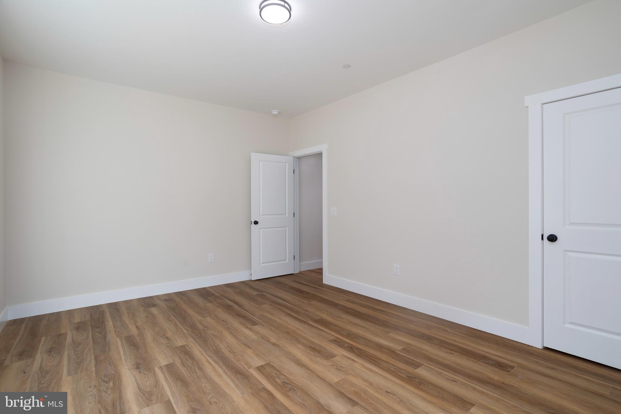 Clark Corner Road Centreville, MD 21617 - Photo 12 of 43 a view of an empty room with wooden floor