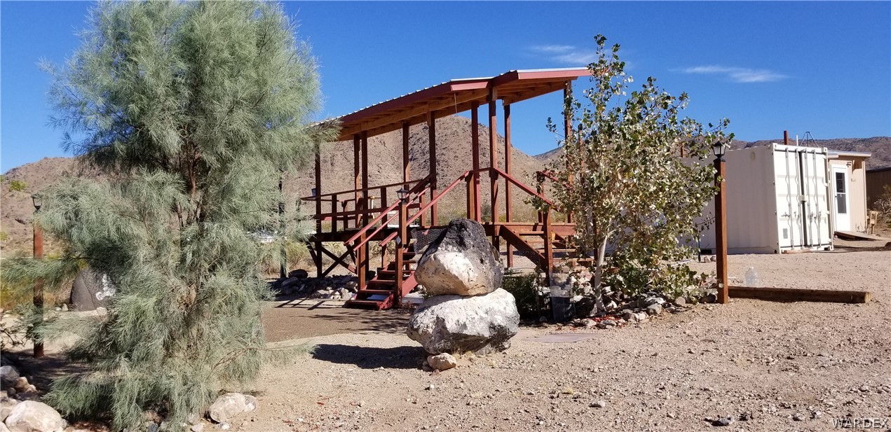 4550 Smoketree Road Golden Valley, AZ 86413 - Photo 20 of 38 a view of a house with a yard and pathway