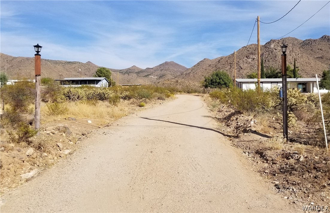 4550 Smoketree Road Golden Valley, AZ 86413 - Photo 2 of 38 a view of a road with a building in the background