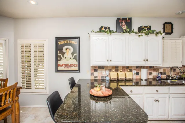 a view of a table and chairs in the kitchen