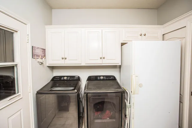 a bedroom with a bed and a book shelf