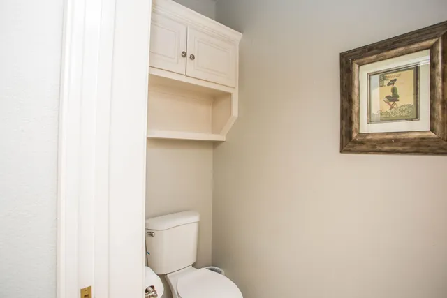 a view of a livingroom with workspace and a window