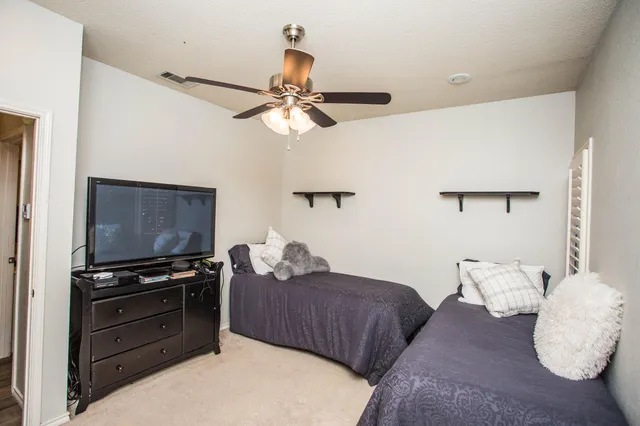 a bathroom with a sink mirror and a bath tub