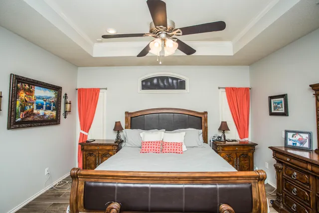a spacious bathroom with a tub a double vanity sink and mirror