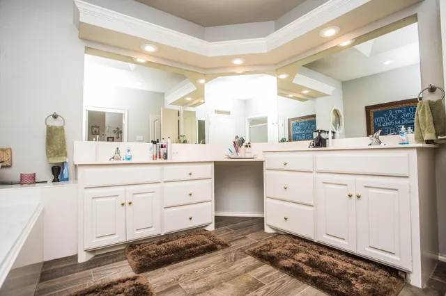 a view of walk in closet with clothes