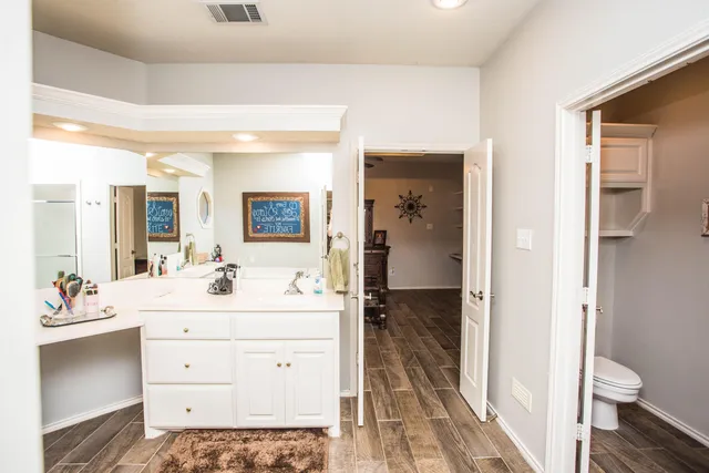 a view of a backyard with a large tree