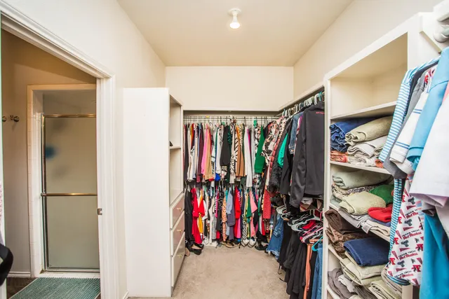 a view of a yard with an tree and a fence