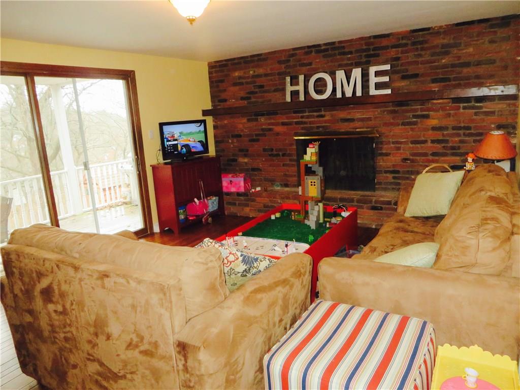 181 Seegar Road Upper St. Clair, PA 15241 - Photo 9 of 25 Family Room with log burning fire place and door to covered deck
