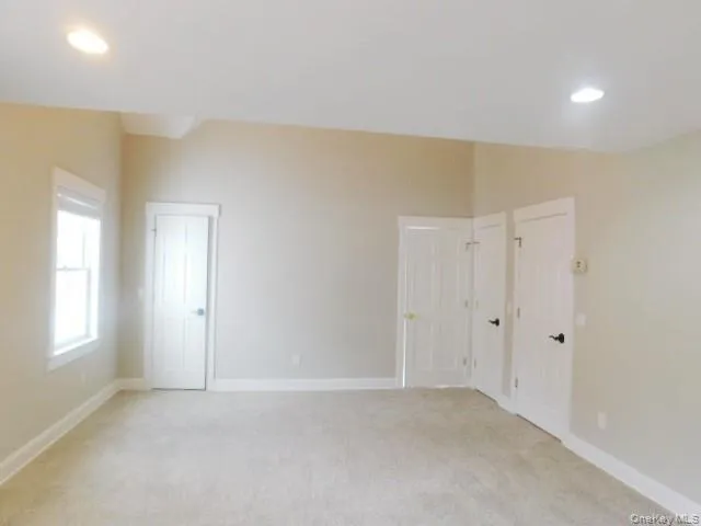 a bath tub sitting in a bathroom next to a window