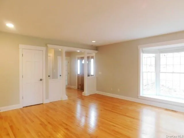 a kitchen with granite countertop a sink stove and cabinets