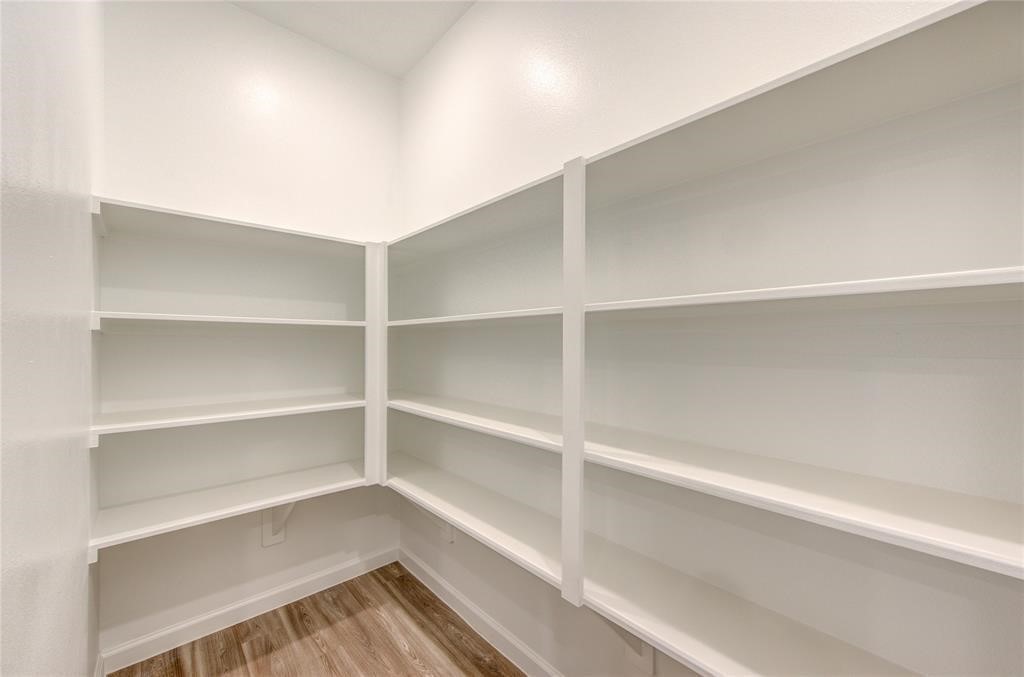 94 Valiant Ridge Trail Magnolia, TX 77354 - Photo 7 of 13 a view of walk in closet with empty racks