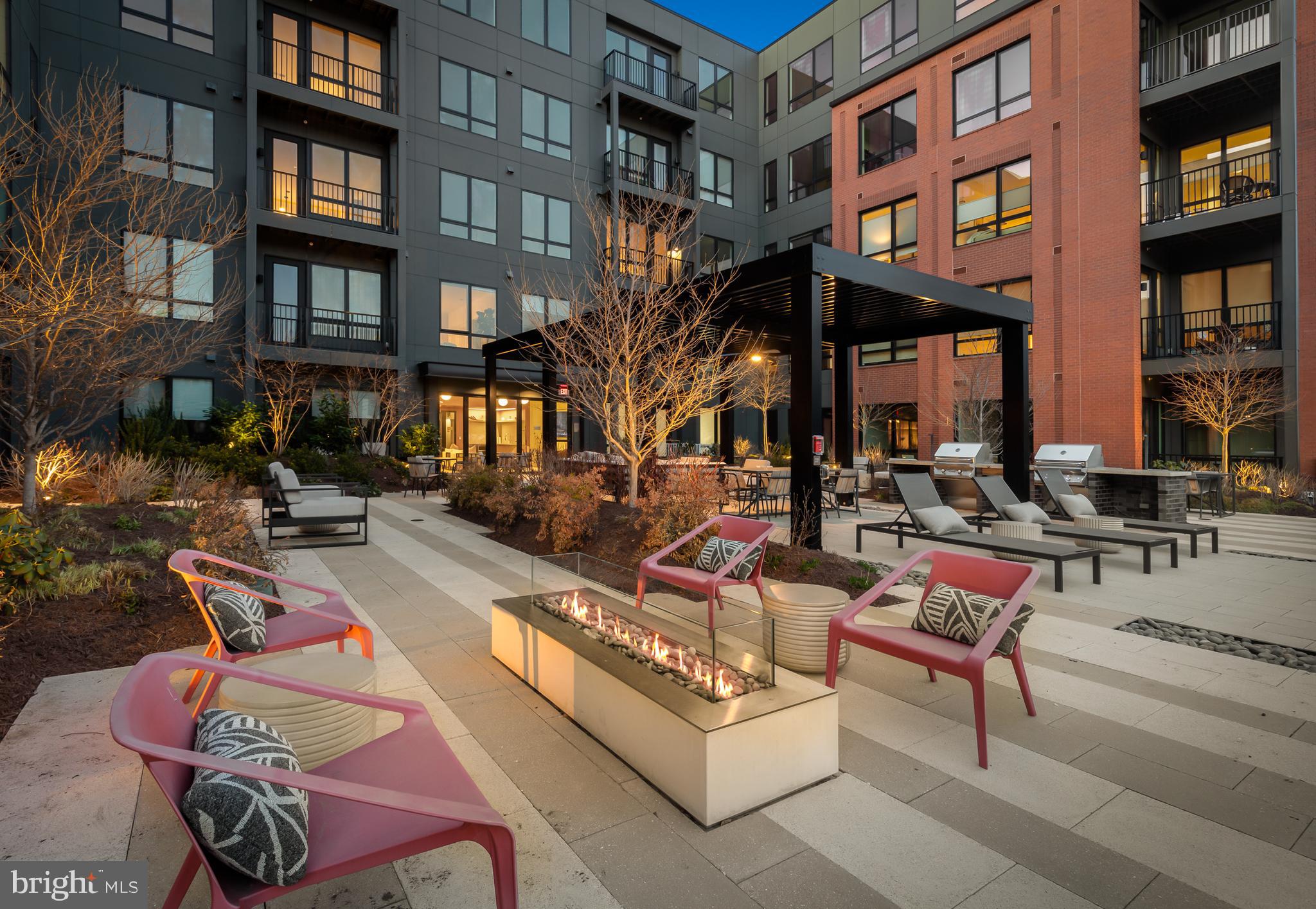 7175 12th Street Northwest, Unit 614 Washington, DC 20012 - Photo 11 of 23 a view of pool with outdoor seating
