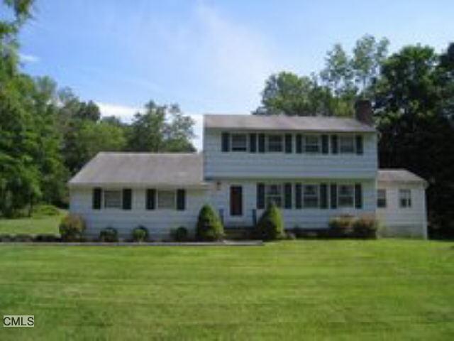 218 Farmingville Road Ridgefield, CT 06877 - Photo 1 of 1 a front view of a house with a garden