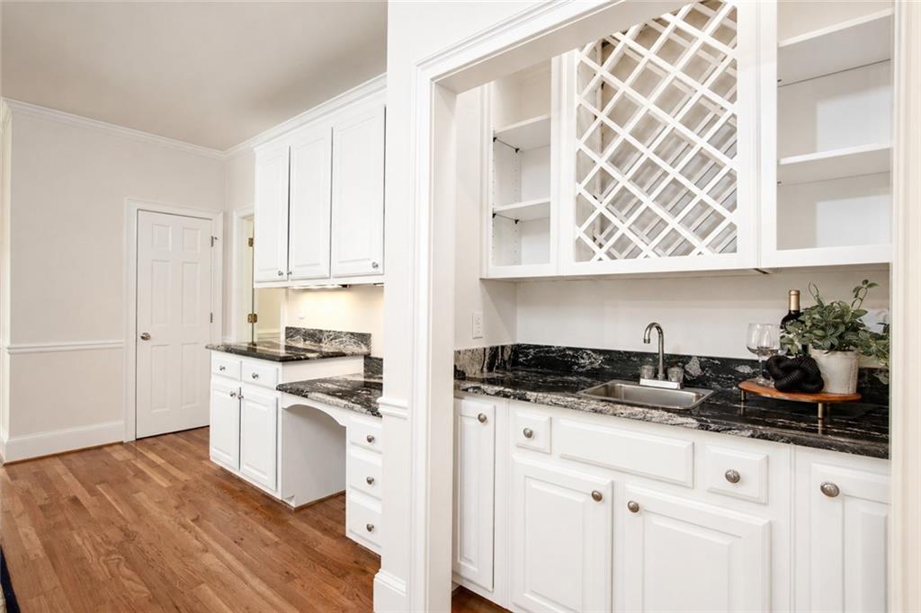 2935 Coles Way Atlanta, GA 30350 - Photo 12 of 56 a kitchen with stainless steel appliances granite countertop a stove a sink and white cabinets