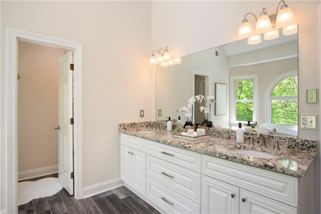 2935 Coles Way Atlanta, GA 30350 - Photo 26 of 56 a bathroom with a sink double vanity and a mirror