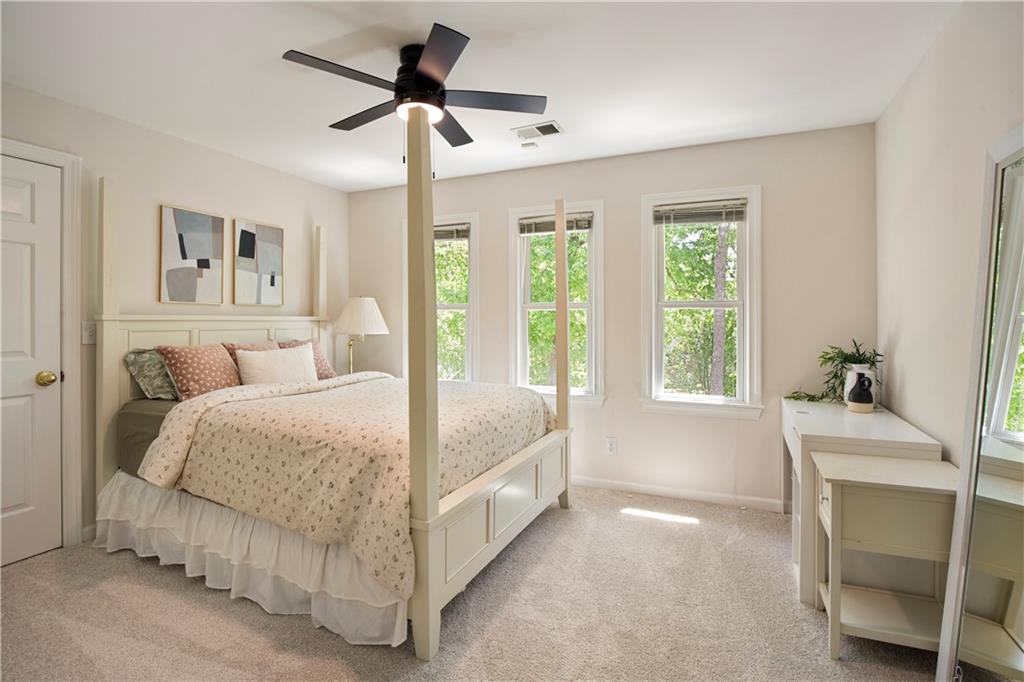 2935 Coles Way Atlanta, GA 30350 - Photo 28 of 56 a spacious bedroom with a bed and a window