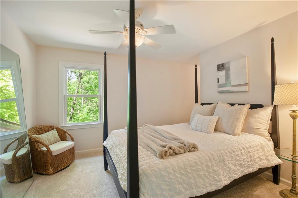 2935 Coles Way Atlanta, GA 30350 - Photo 30 of 56 a bedroom with a bed and a couch