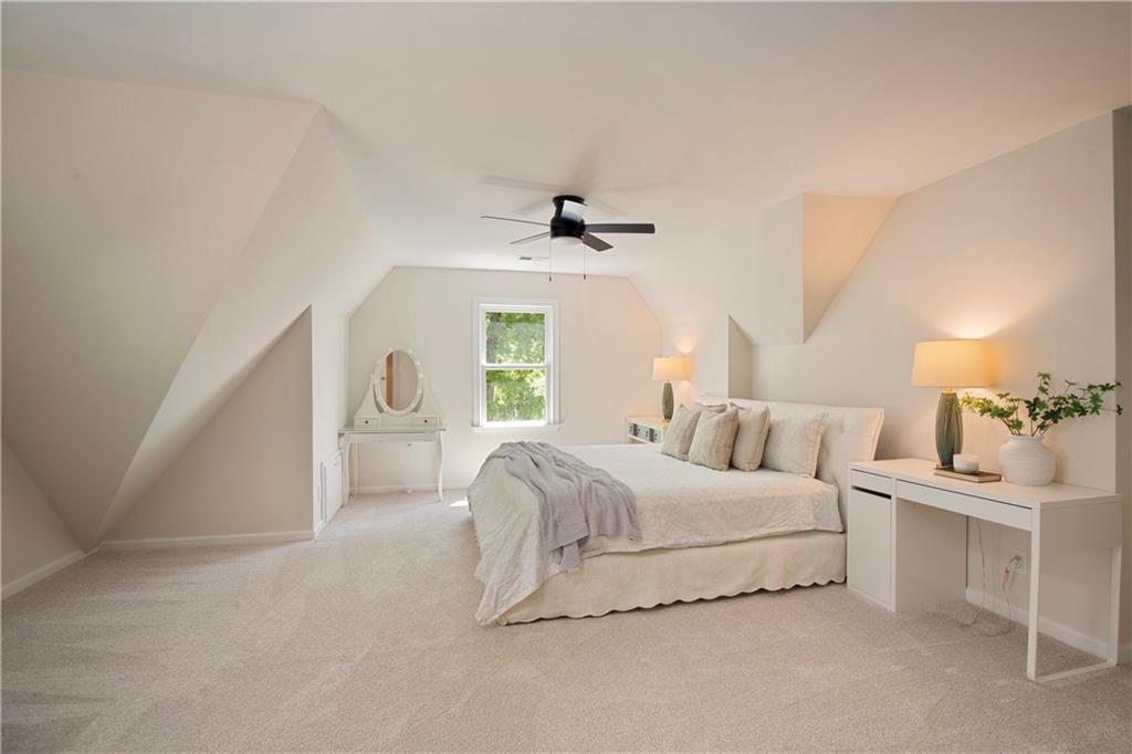 2935 Coles Way Atlanta, GA 30350 - Photo 31 of 56 a spacious bedroom with a bed and a window