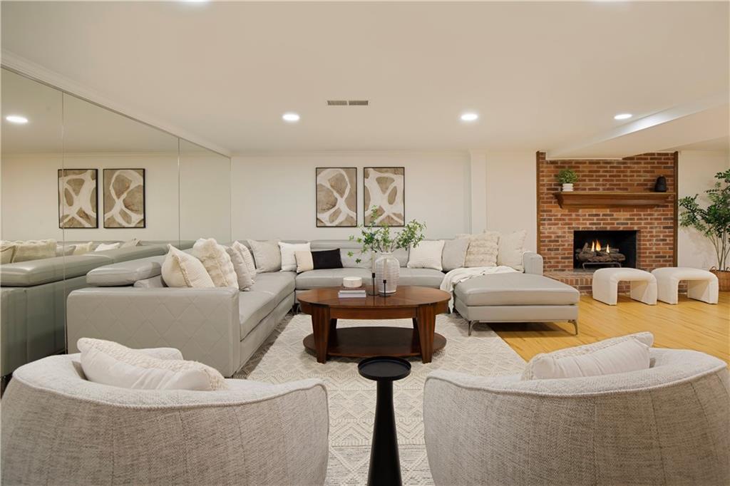 2935 Coles Way Atlanta, GA 30350 - Photo 33 of 56 a living room with furniture and a fireplace