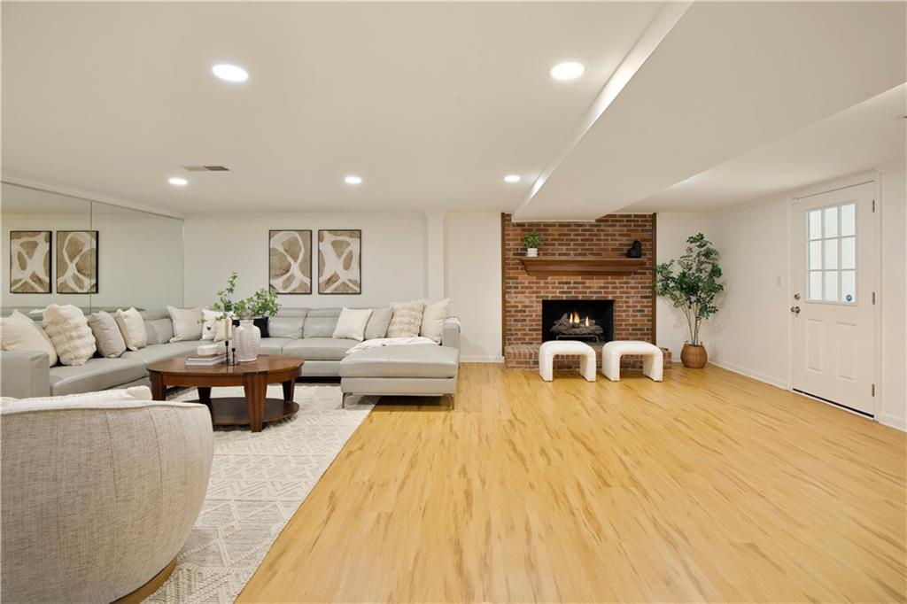 2935 Coles Way Atlanta, GA 30350 - Photo 34 of 56 a living room with furniture and a fireplace