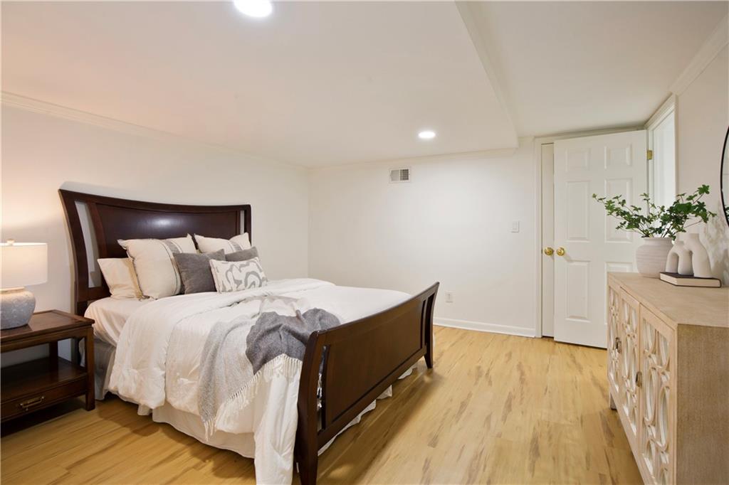 2935 Coles Way Atlanta, GA 30350 - Photo 37 of 56 a bed room with a bed and a potted plant
