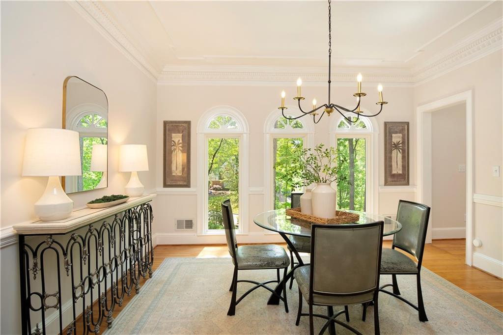 2935 Coles Way Atlanta, GA 30350 - Photo 5 of 56 a dining room with furniture a chandelier and wooden floor