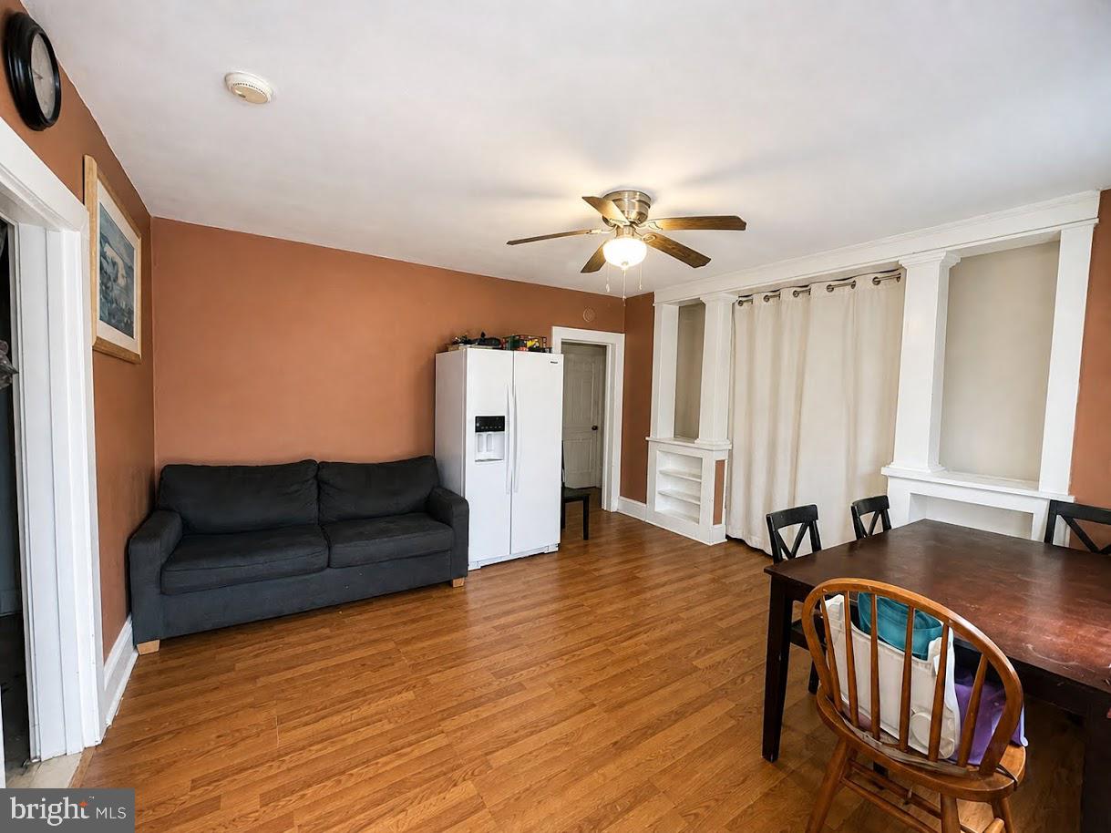 305 Rosa Street Georgetown, DE 19947 - Photo 4 of 6 a living room with furniture and wooden floor