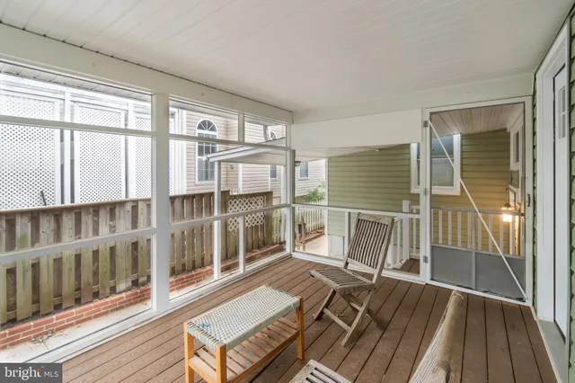 en suite bathroom with a sink and glass door