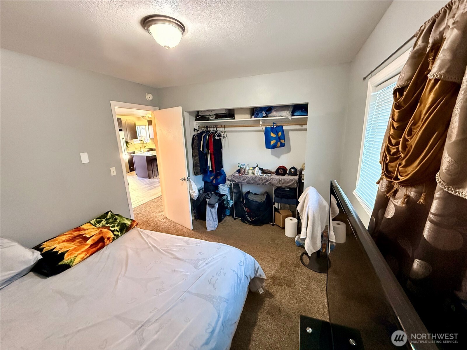 812 Ferry Street Wenatchee, WA 98801 - Photo 9 of 29 a bed room with a bed and a couch