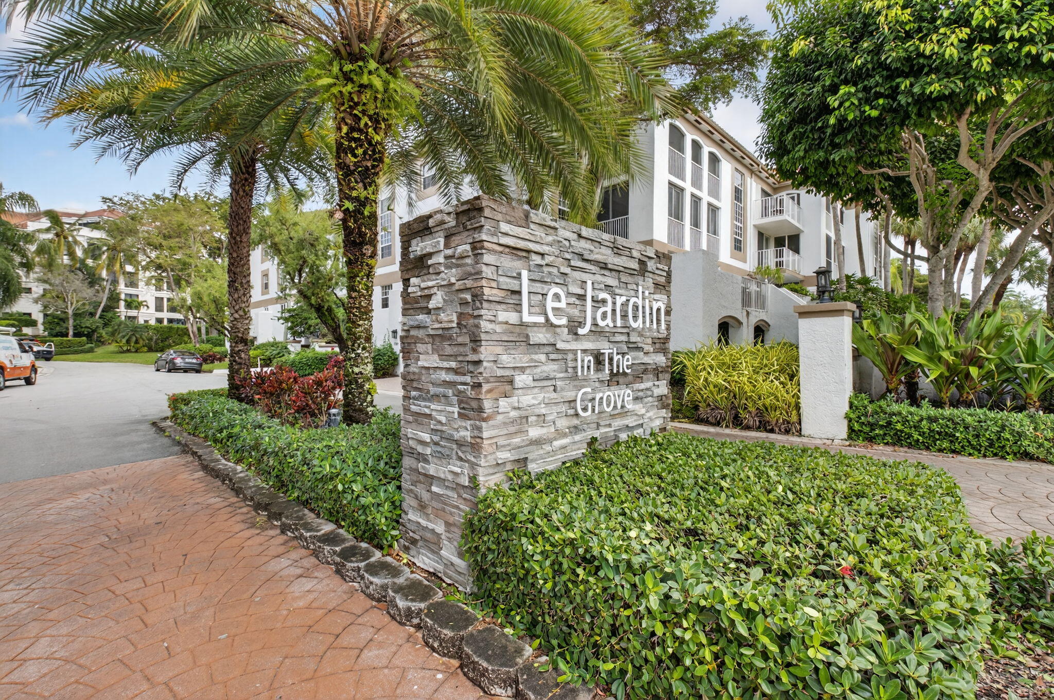 7369 Orangewood Lane, Unit 307 Boca Raton, FL 33433 - Photo 1 of 37 a view of a garden with a building