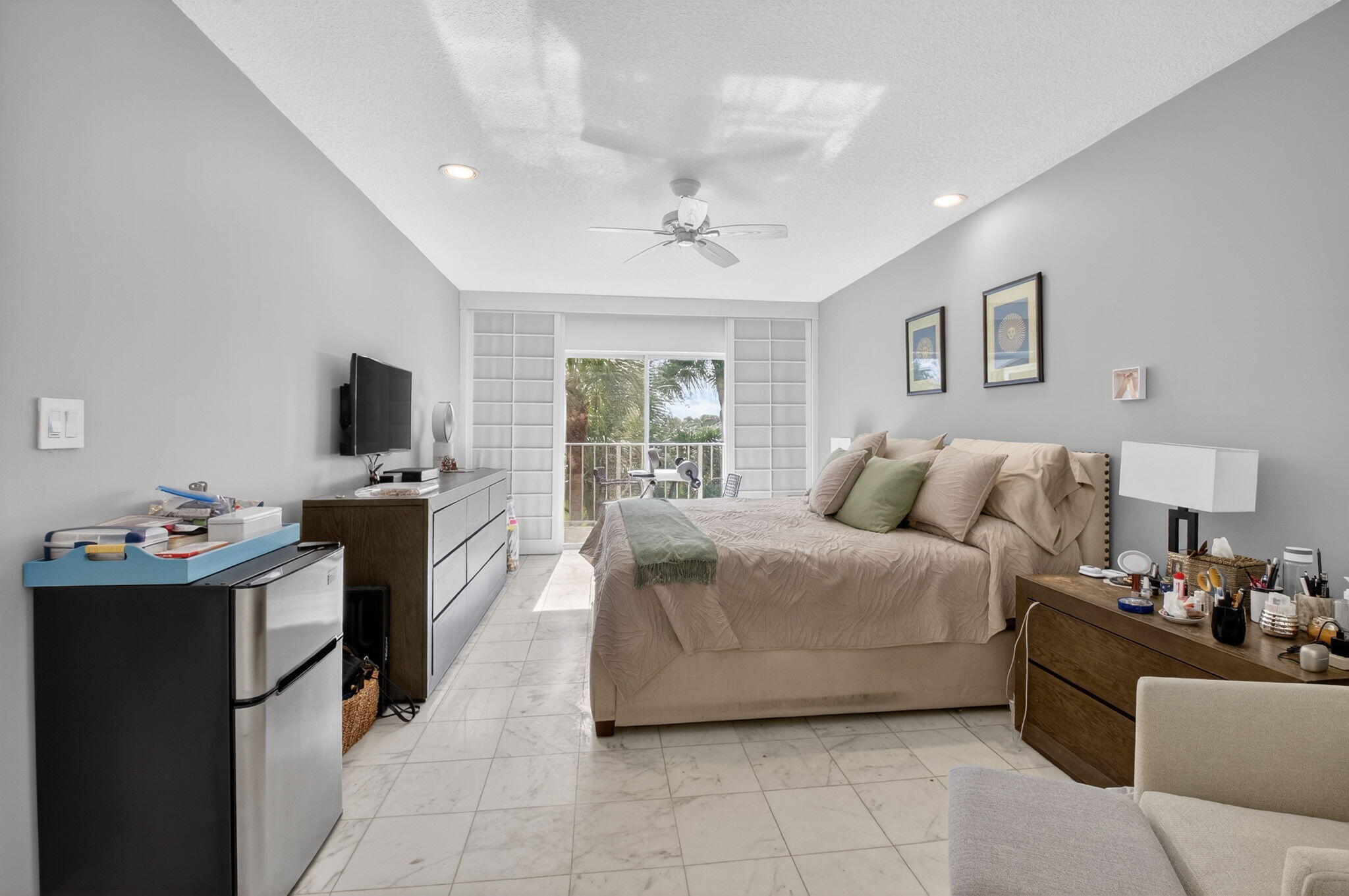 7369 Orangewood Lane, Unit 307 Boca Raton, FL 33433 - Photo 20 of 37 a living room with furniture and a flat screen tv