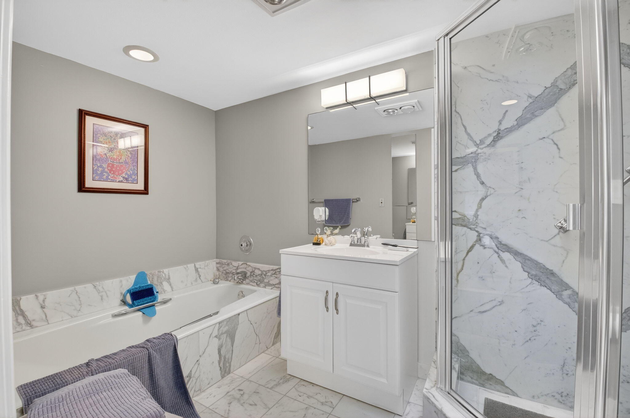7369 Orangewood Lane, Unit 307 Boca Raton, FL 33433 - Photo 23 of 37 a bathroom with a sink a vanity and a mirror