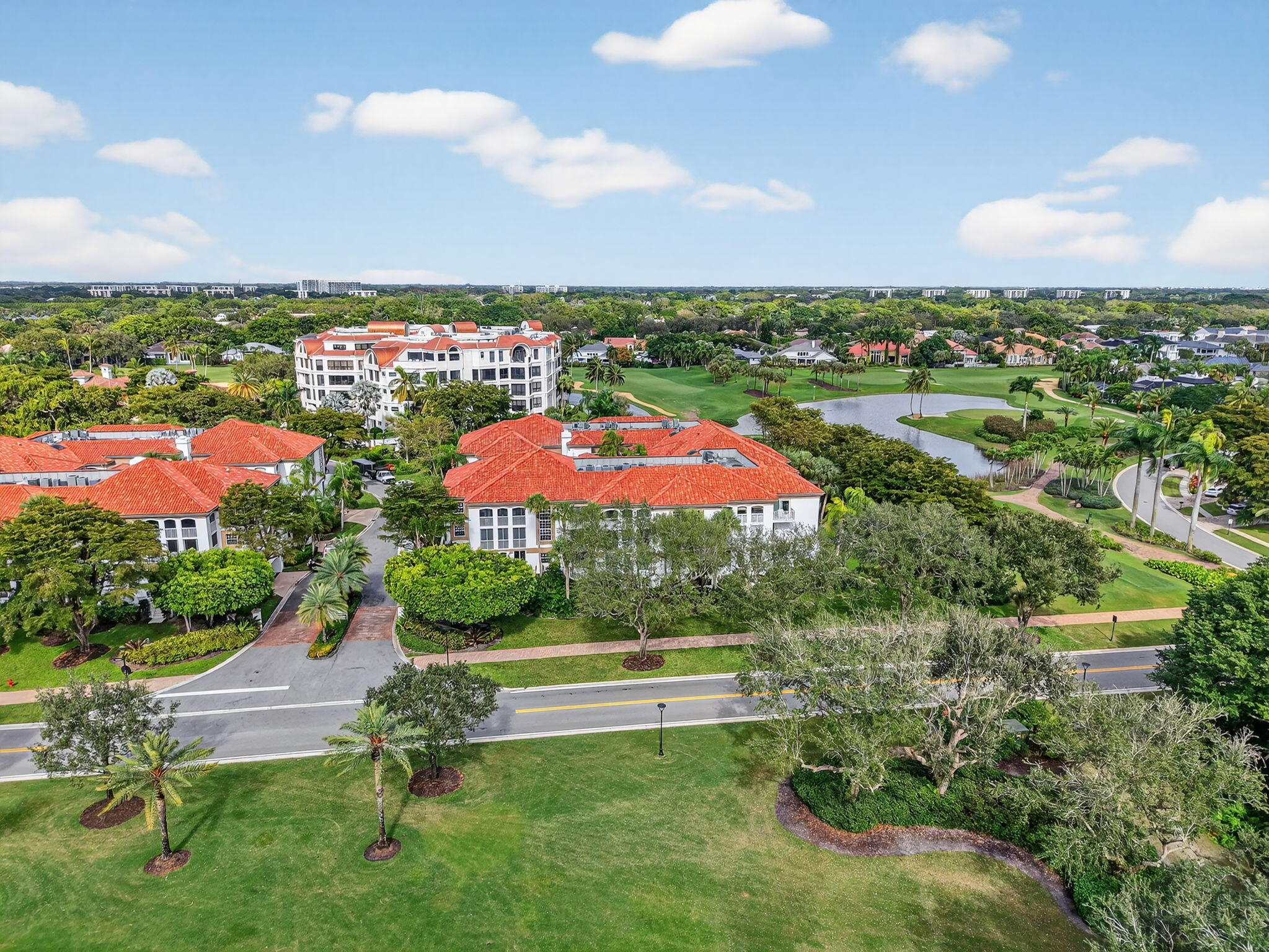 7369 Orangewood Lane, Unit 307 Boca Raton, FL 33433 - Photo 29 of 37 an aerial view of a house with a yard and lake view