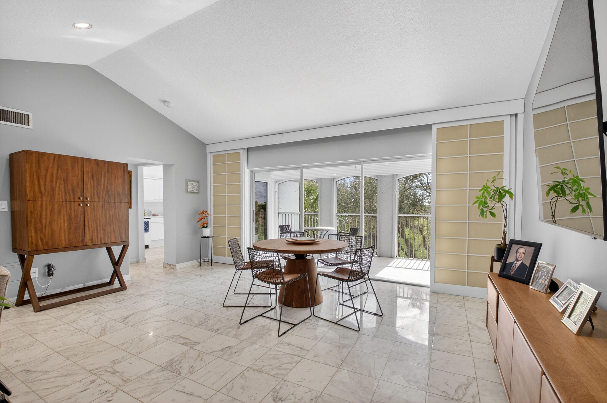 7369 Orangewood Lane, Unit 307 Boca Raton, FL 33433 - Photo 7 of 37 a living room with furniture and large windows