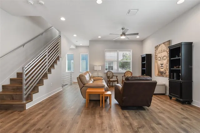 a living room with furniture and a large window