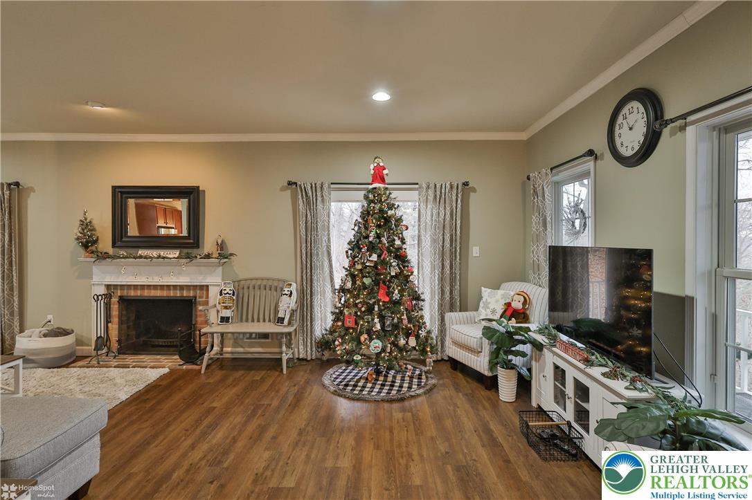 3475 Honeysuckle Road Bethlehem, PA 18015 - Photo 13 of 87 a living room with furniture a flat screen tv and a fireplace