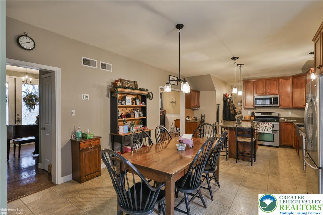 3475 Honeysuckle Road Bethlehem, PA 18015 - Photo 19 of 87 a dining room with furniture and wooden floor