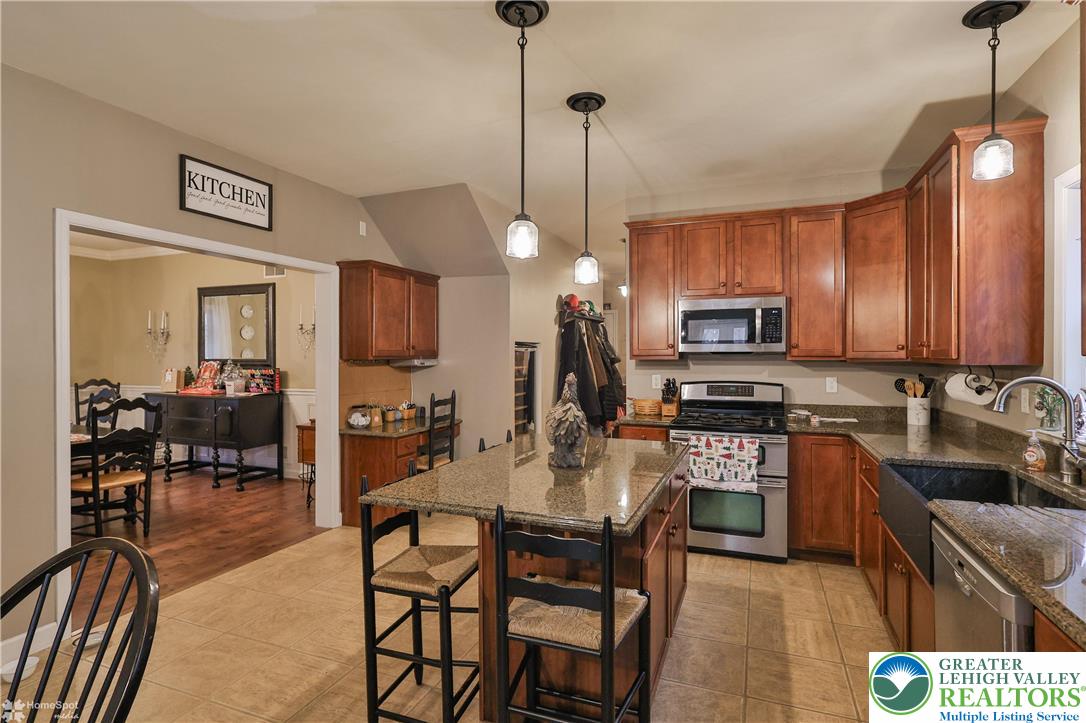 3475 Honeysuckle Road Bethlehem, PA 18015 - Photo 24 of 87 a kitchen with stainless steel appliances a stove a sink island and a refrigerator