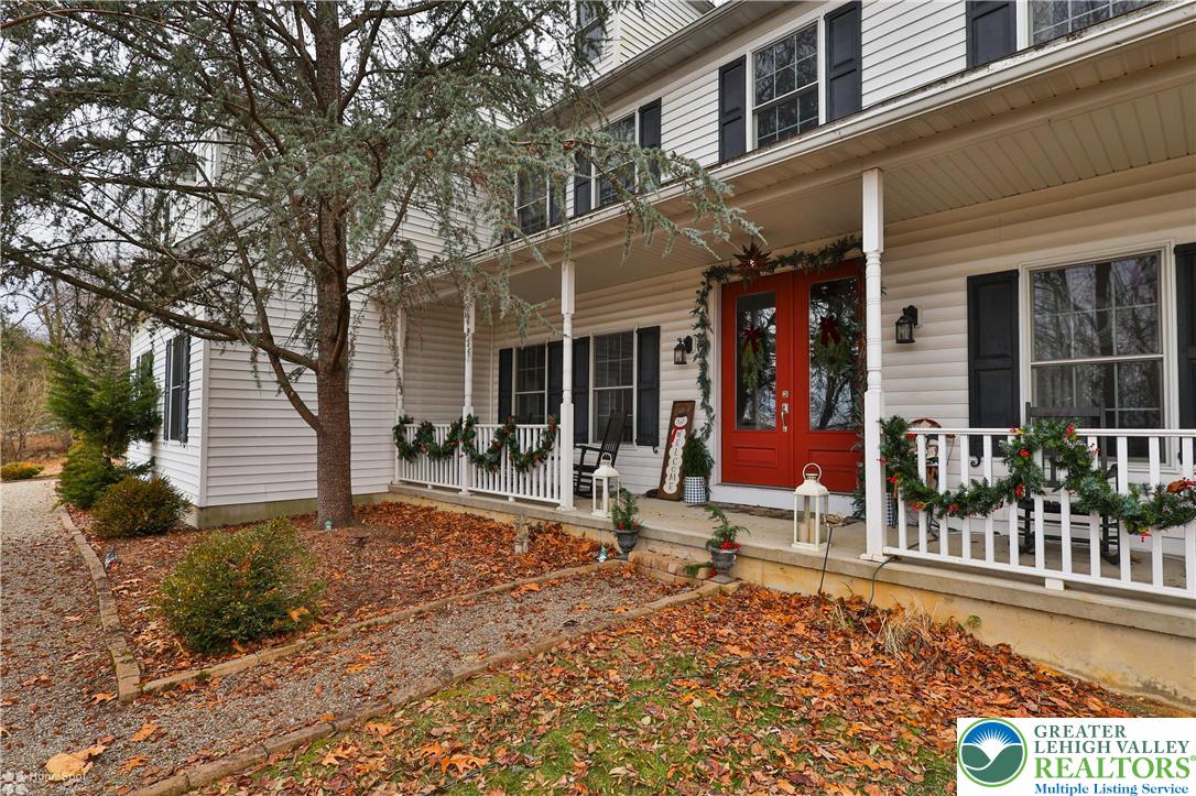 3475 Honeysuckle Road Bethlehem, PA 18015 - Photo 4 of 87 a view of a house with large windows and plants