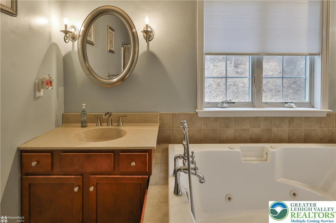 3475 Honeysuckle Road Bethlehem, PA 18015 - Photo 43 of 87 a bathroom with a sink and a mirror