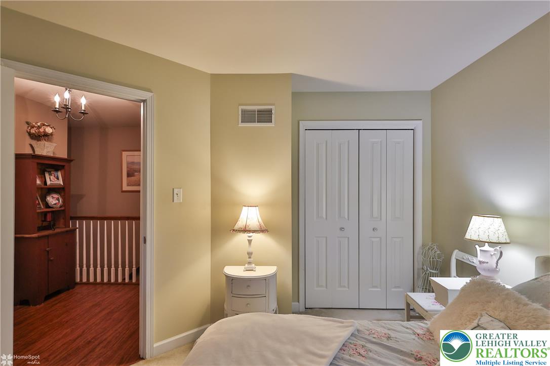 3475 Honeysuckle Road Bethlehem, PA 18015 - Photo 51 of 87 a bedroom with a bed and wooden floor