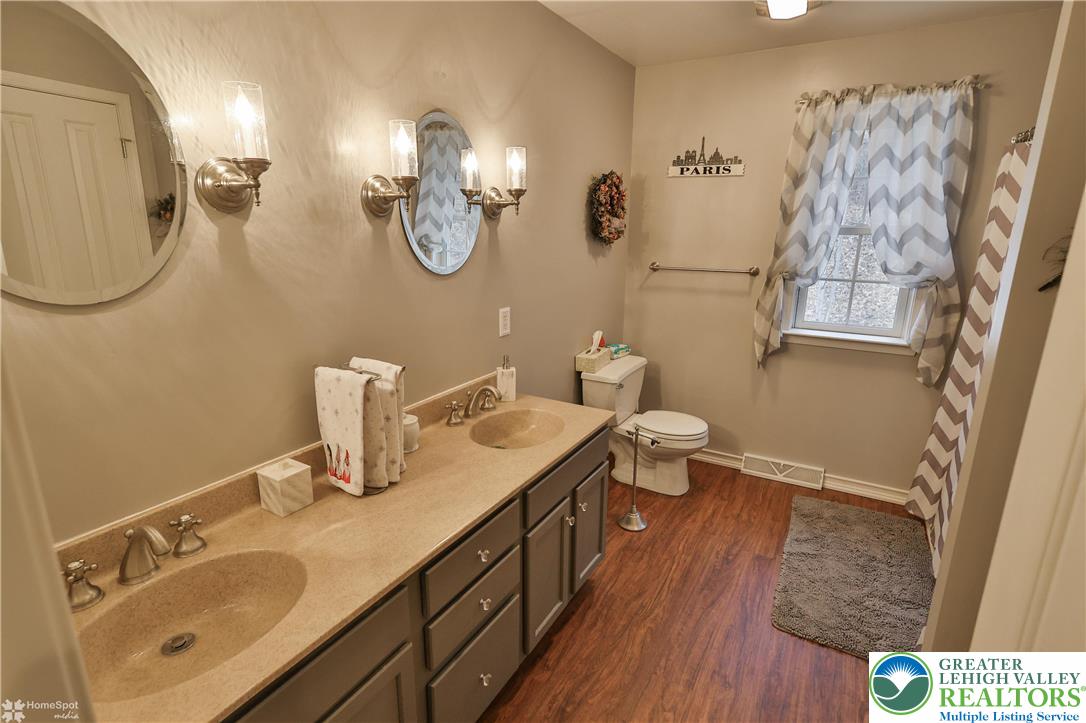 3475 Honeysuckle Road Bethlehem, PA 18015 - Photo 55 of 87 a bathroom with a double vanity sink mirror and toilet