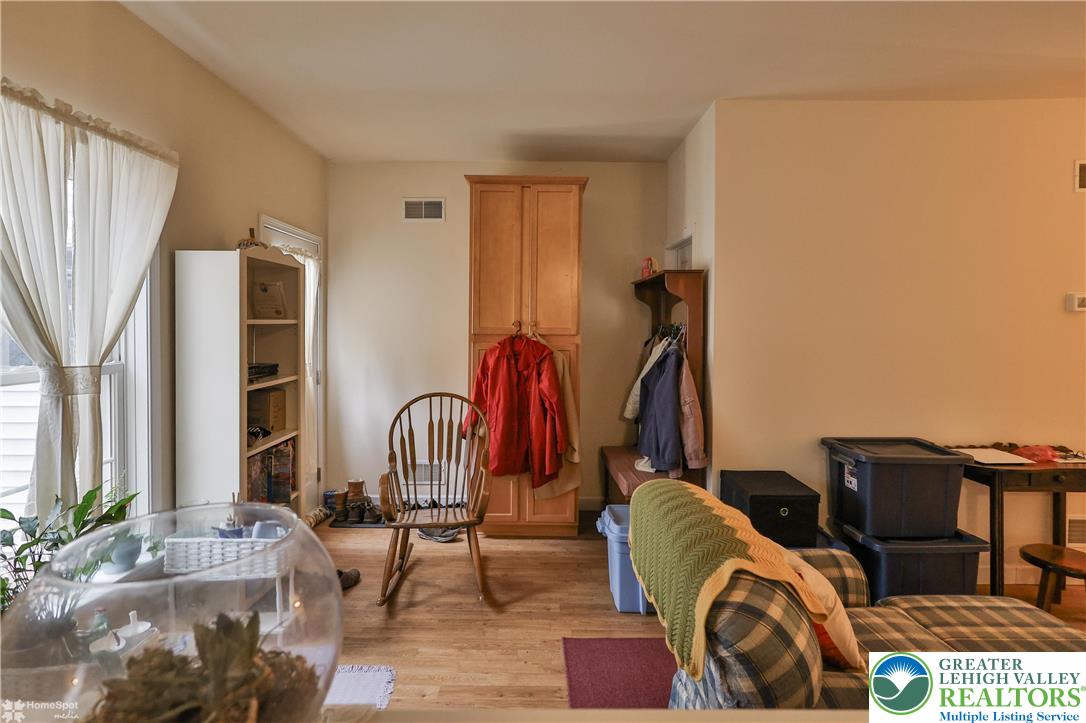3475 Honeysuckle Road Bethlehem, PA 18015 - Photo 62 of 87 a living room with furniture a piano and wooden floor