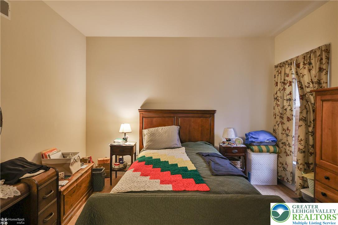 3475 Honeysuckle Road Bethlehem, PA 18015 - Photo 65 of 87 a bed room with a bed and a fireplace