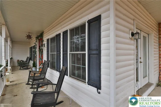 a living room with fireplace furniture and a fireplace