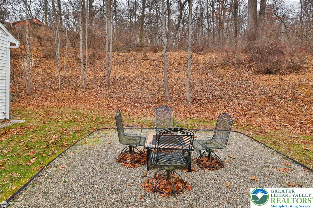 3475 Honeysuckle Road Bethlehem, PA 18015 - Photo 78 of 87 a bench sitting in backside of a house