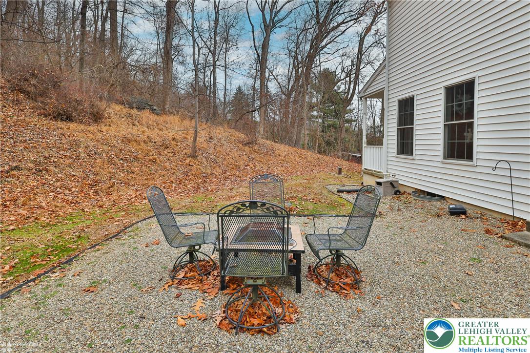 3475 Honeysuckle Road Bethlehem, PA 18015 - Photo 80 of 87 a view of a chairs and table in the backyard